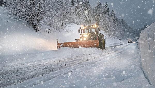 Equipment removing snow on winter roads.